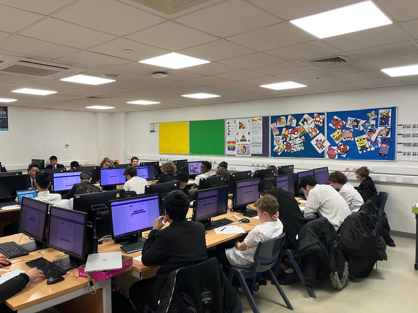 Secondary students working in a computer classroom